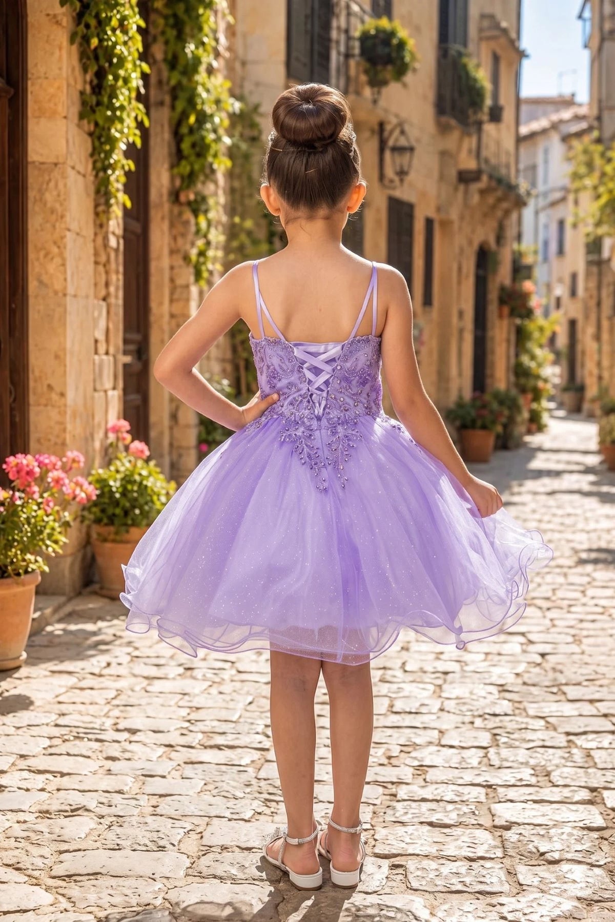 Finished details of back lacing and delicate straps distinguish the Lavendar kids party dress.