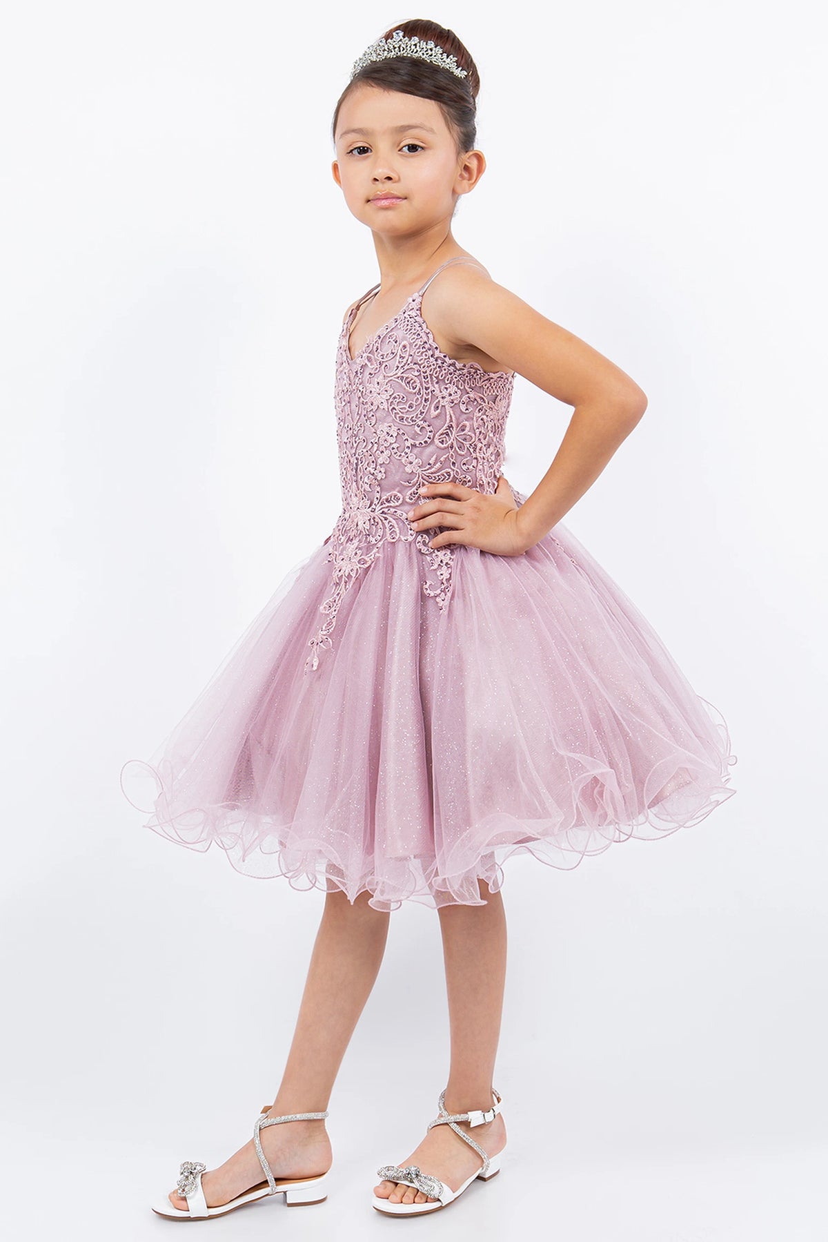 Accented a soft tulle skirt adds character to this Mauve kids party dress.