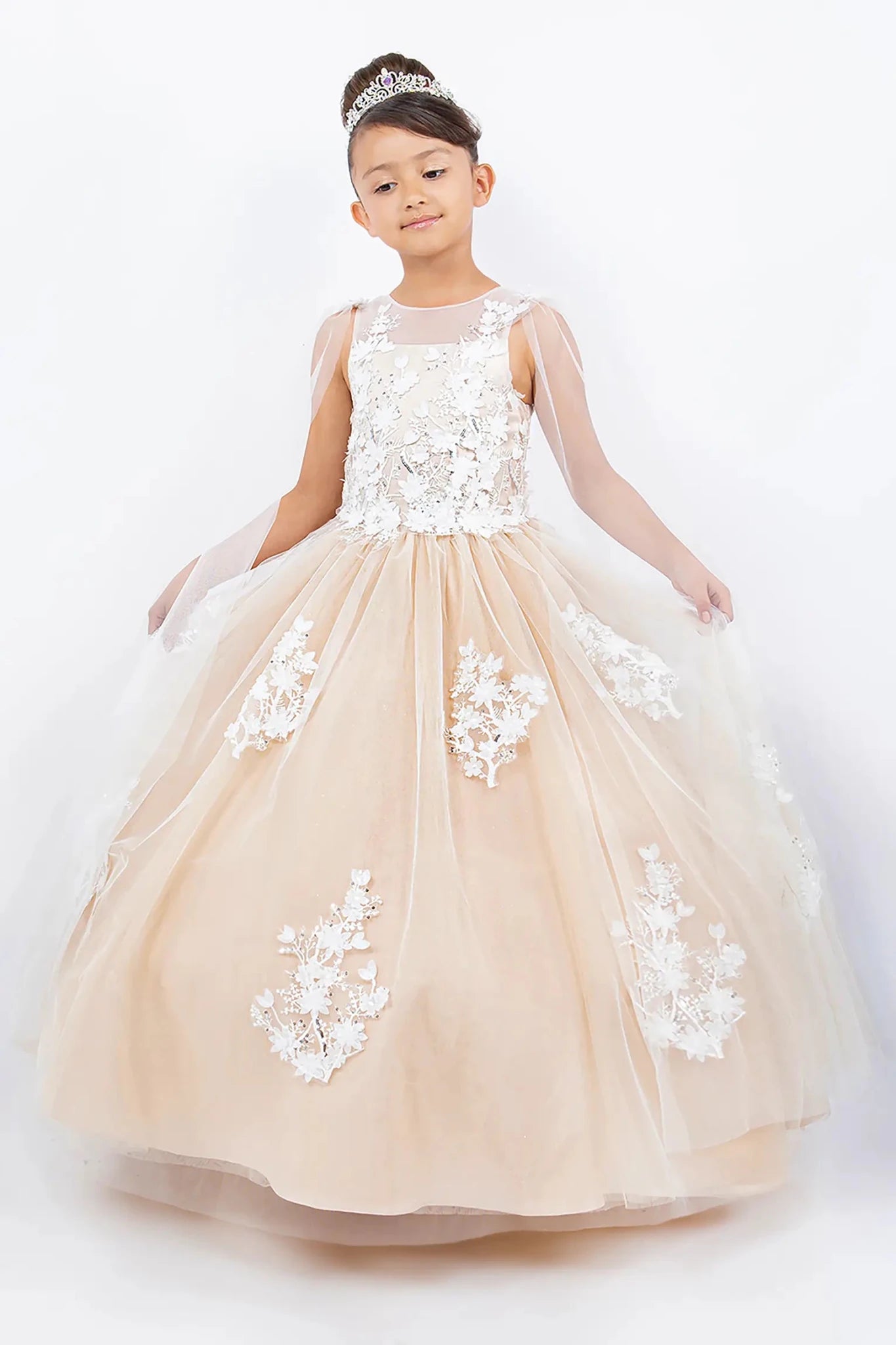 Front view of champagne illusion tulle flower girl mini quince dress with 3D floral appliqué bodice, sheer see-through sleeves, and layered tulle skirt. Also suitable as a flower girl dress.