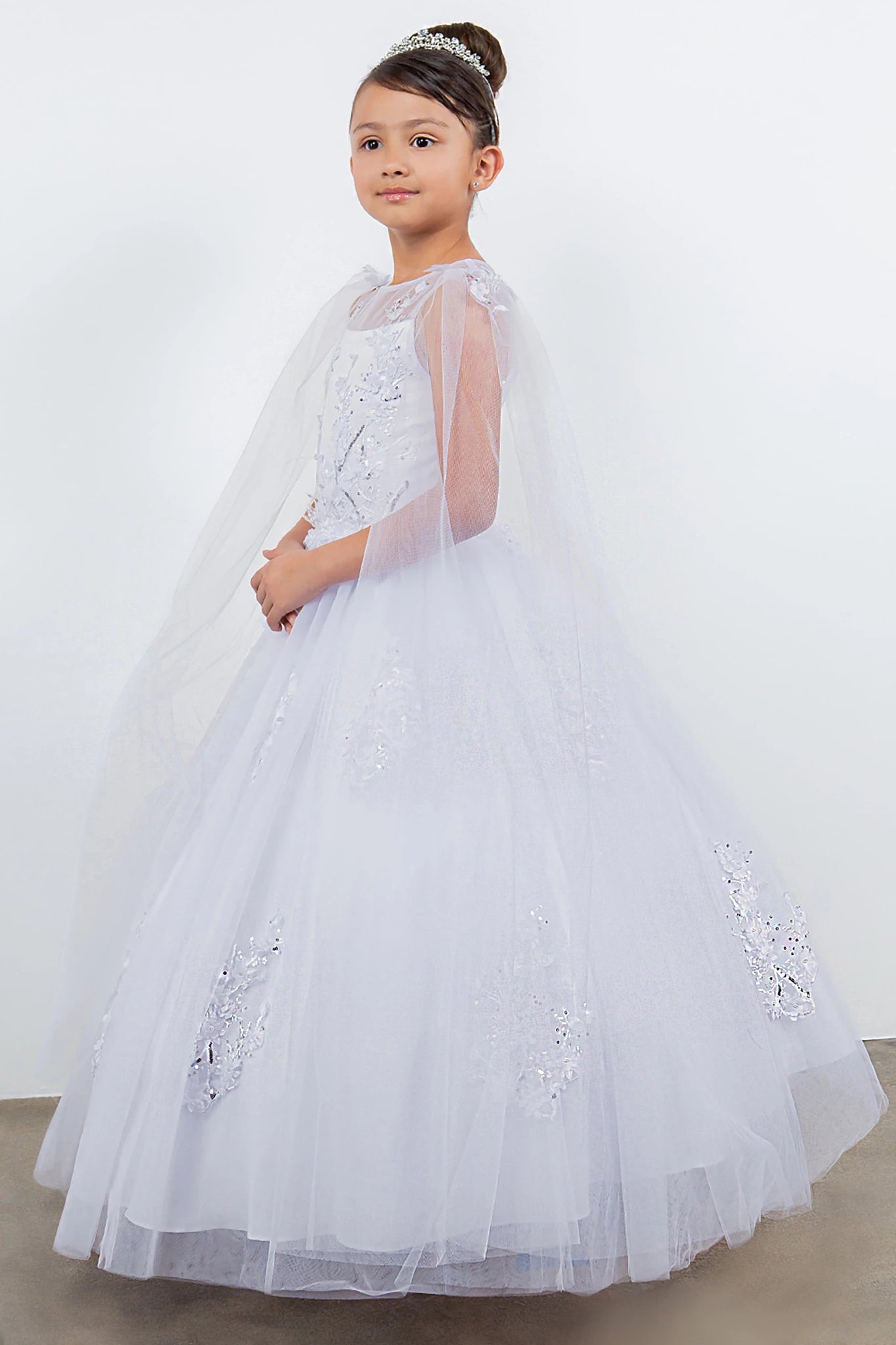A white flower girl dress with a cape.