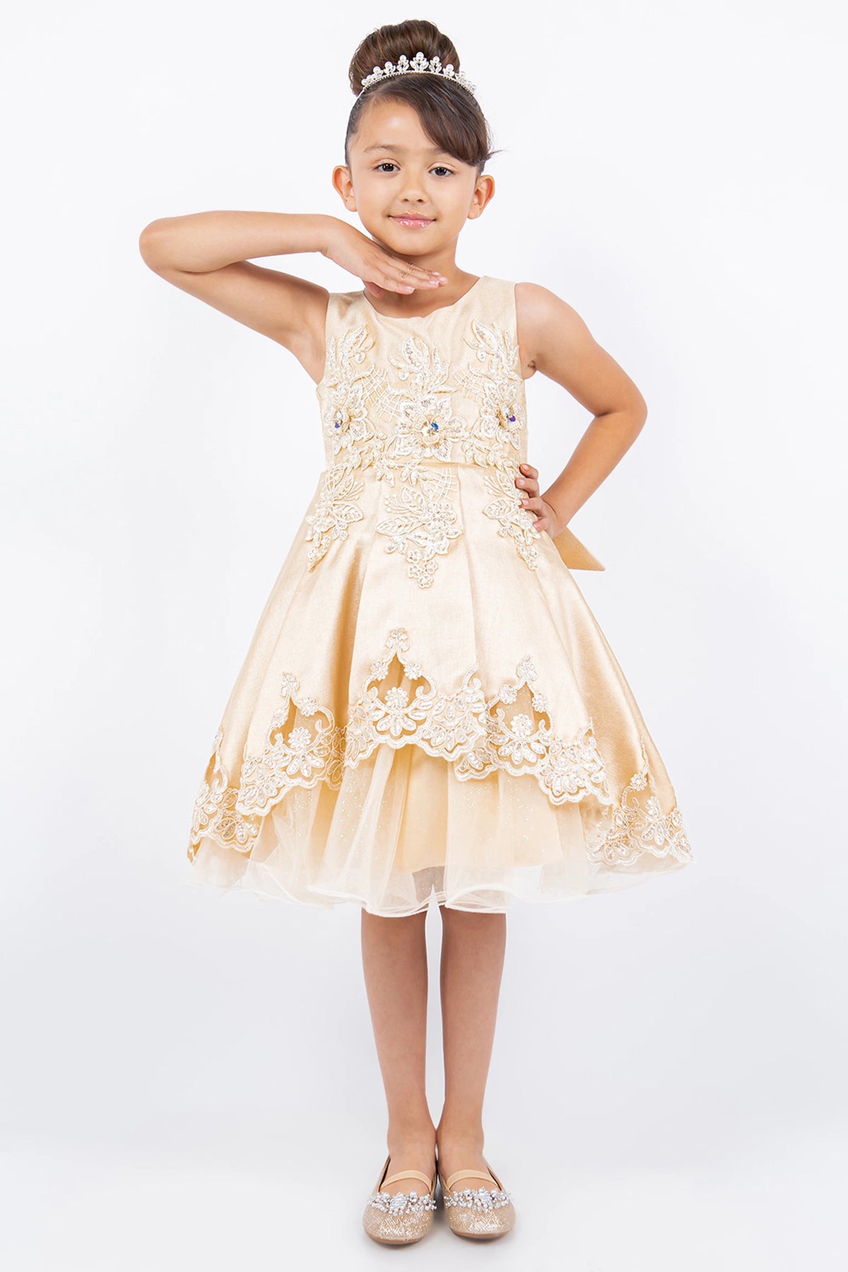 Details of the Champagne flower girl dress include floral embroidery at the waist and hem.