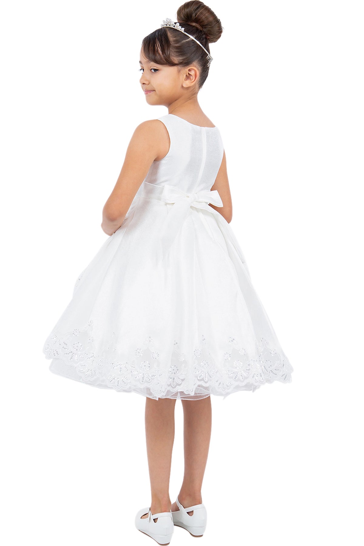 A Off-White flower girl dress showing satin bow above the lace-trimmed back skirt.