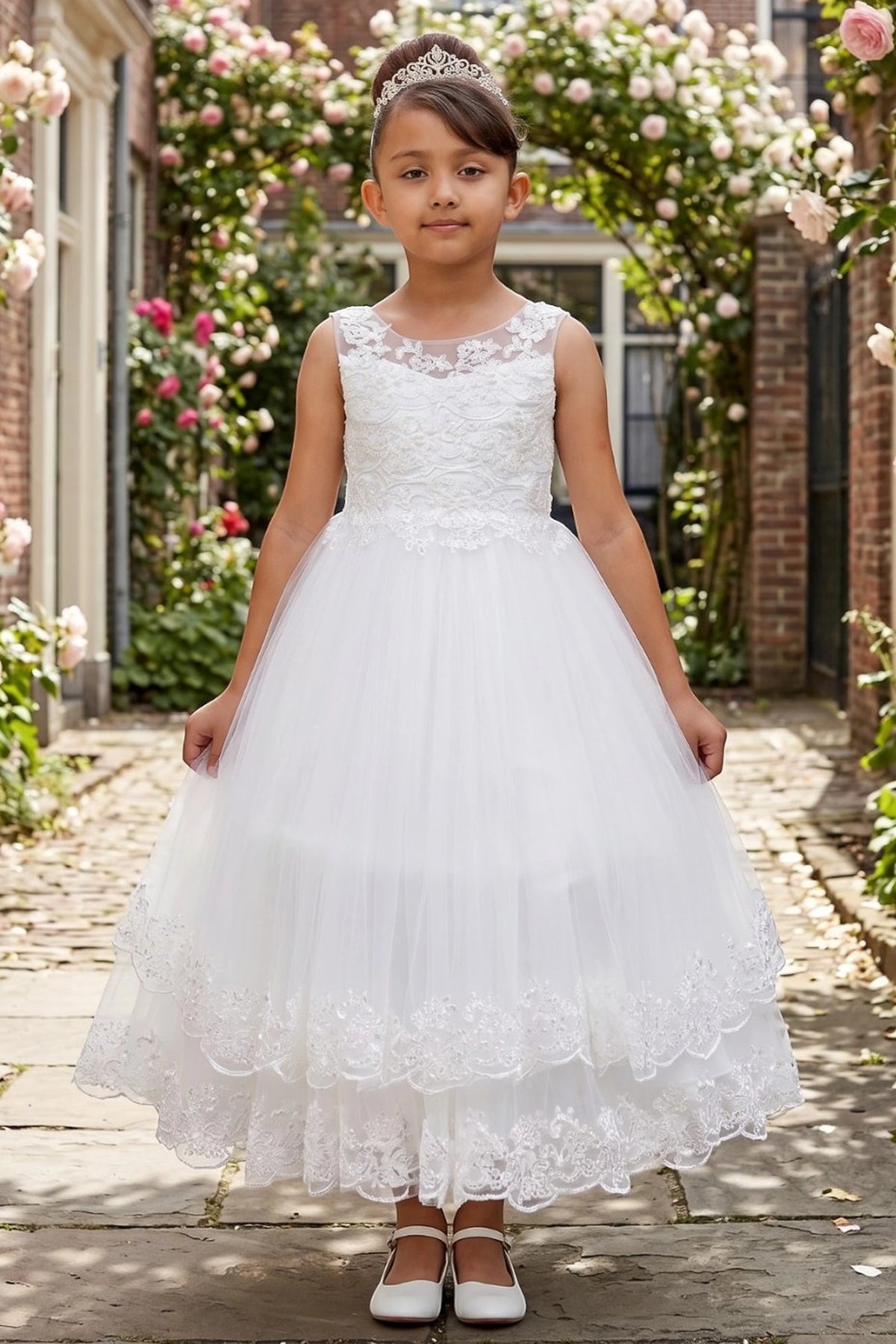 Off-White flower girl dress features layered tulle skirt with scalloped lace trim.
