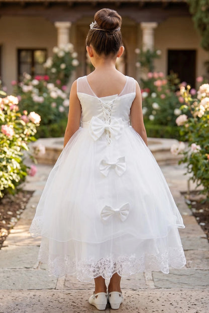 A Off-White flower girl dress showing lace-up back and two satin bows.