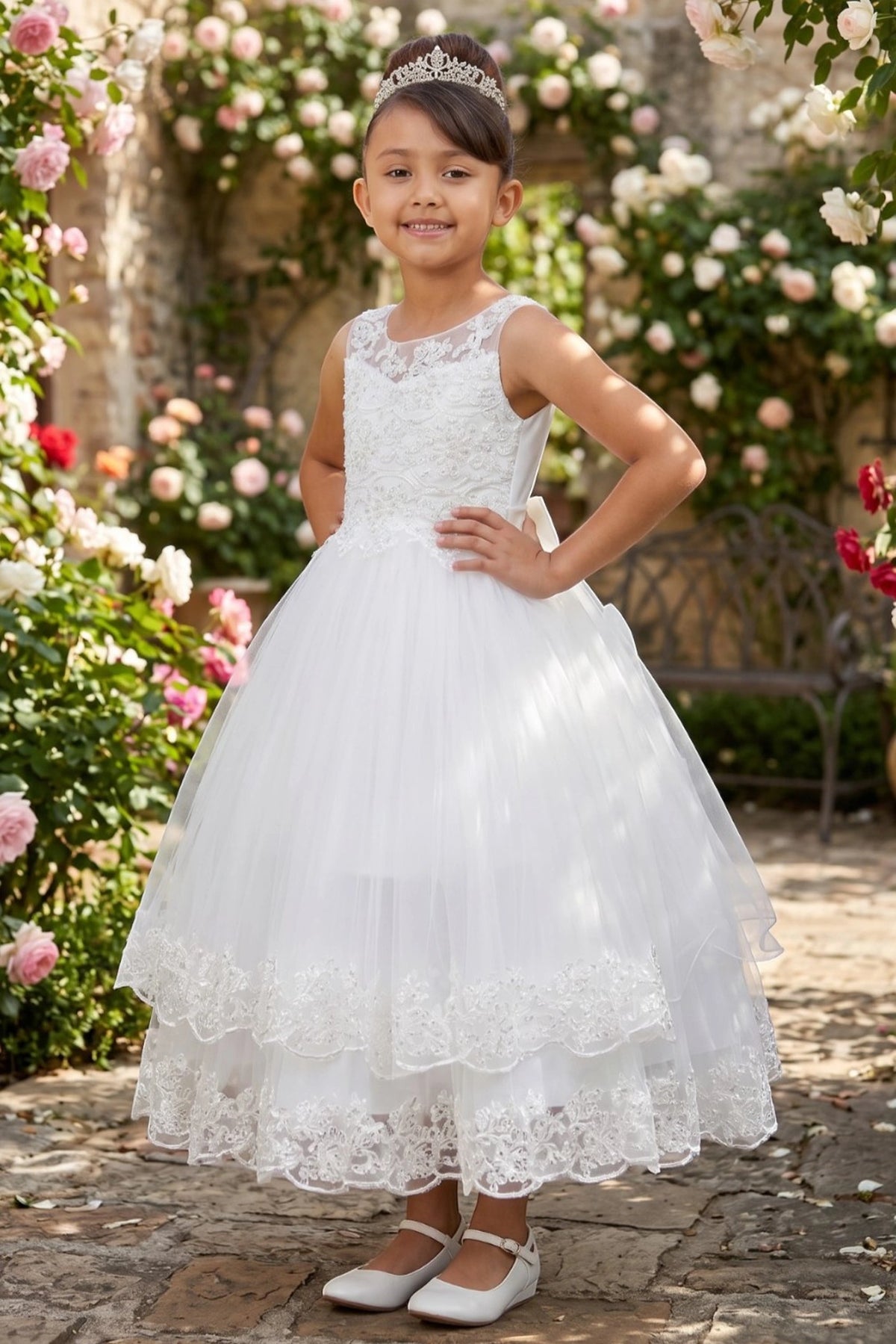 Featuring lace-trimmed tiers beneath the fitted bodice on the Off-White flower girl dress.