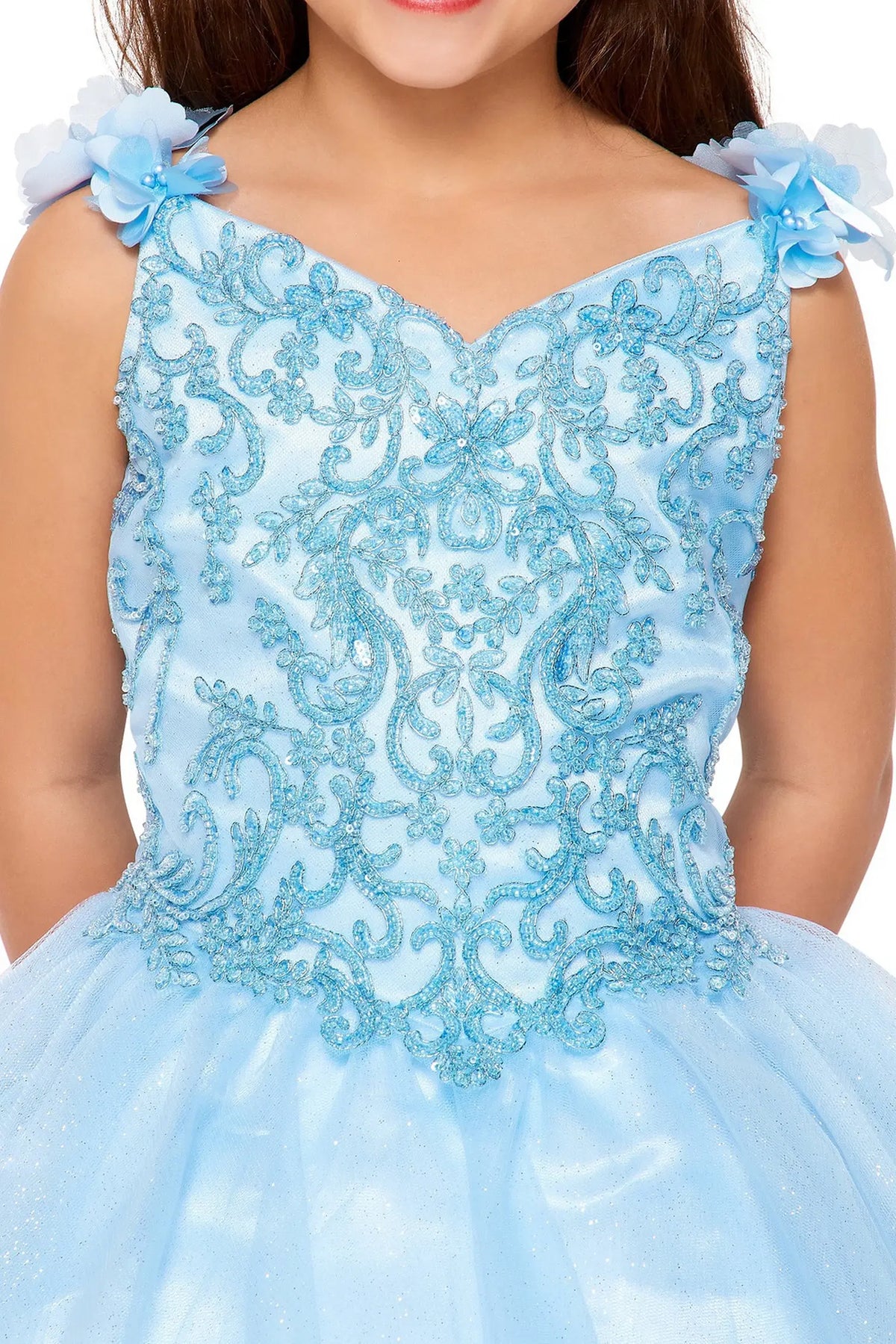 Detailed by dimensional flowers along the straps, the Blue kids party dress reveals its construction.
