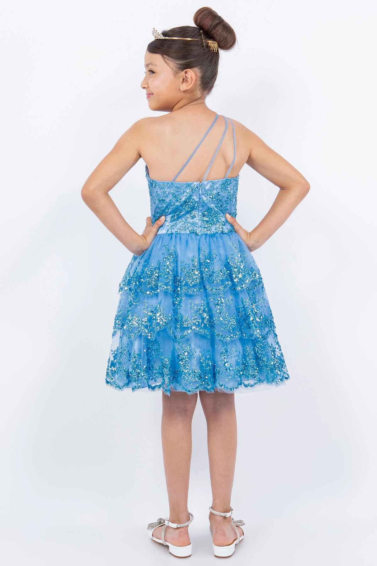Finished details of a low back with angled straps distinguish the Blue kids party dress.