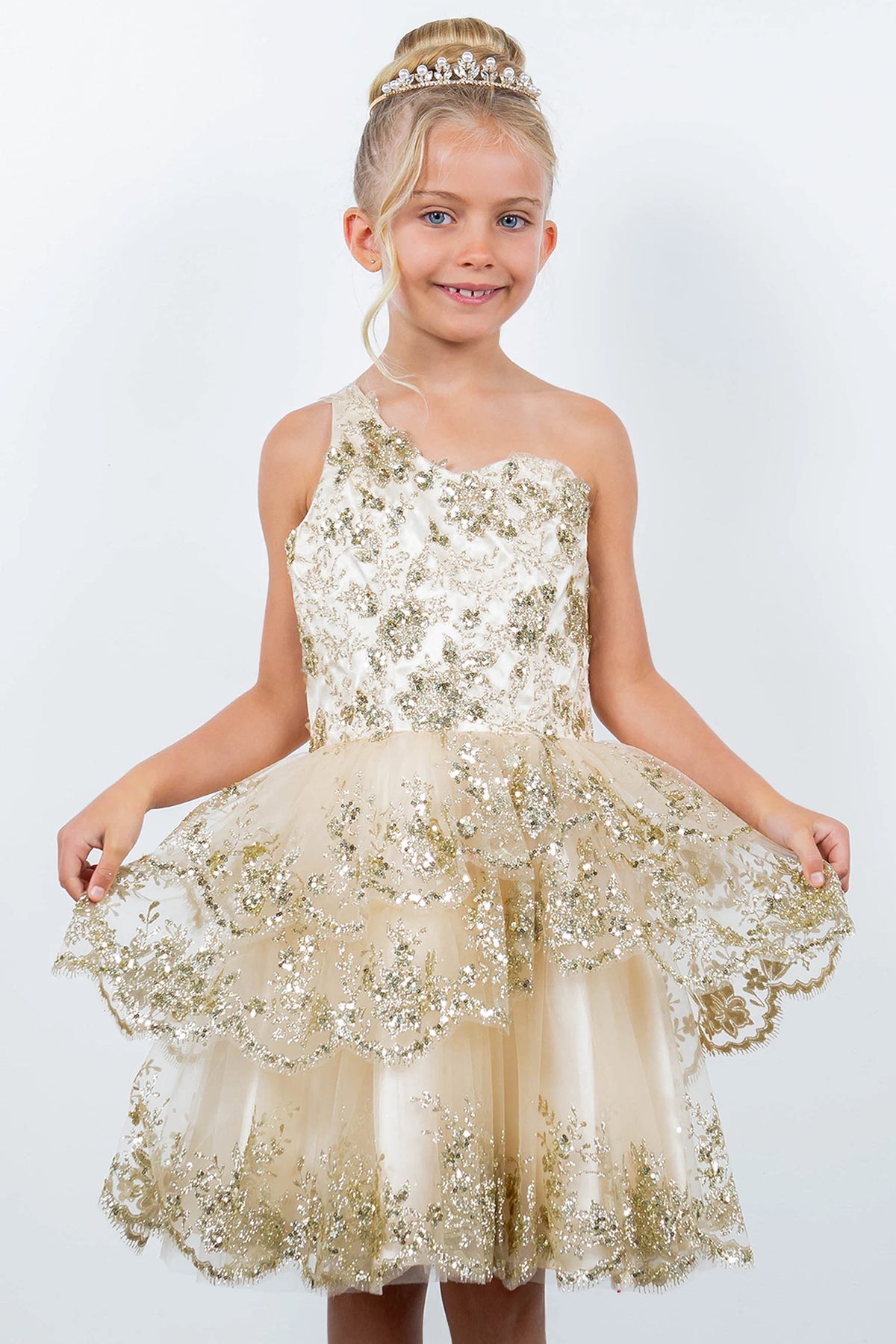 Featuring with floral shimmer on the bodice, this Champagne kids party dress displays elegant detail.