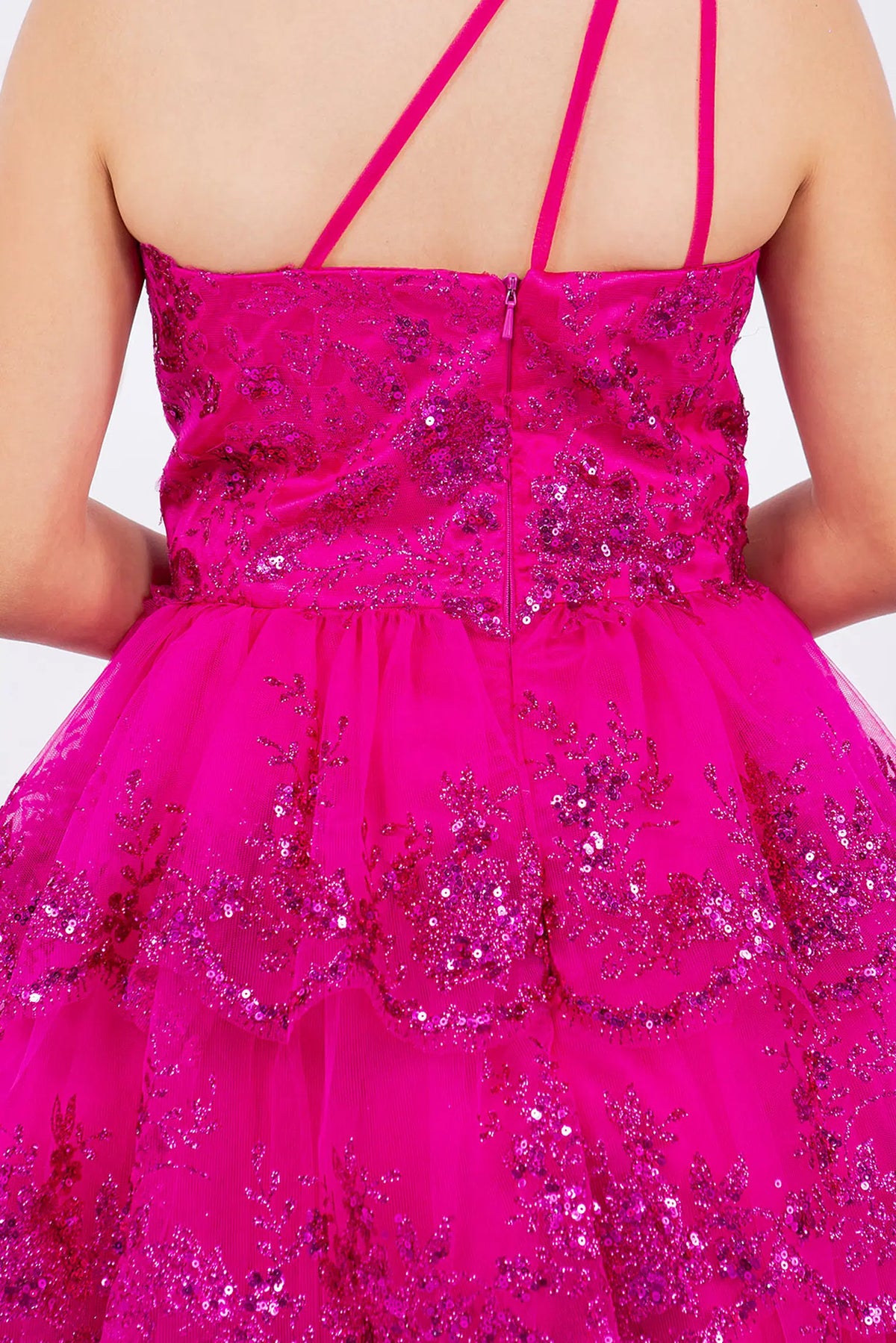 Finished details of a low back with angled straps distinguish the Fuchsia kids party dress.
