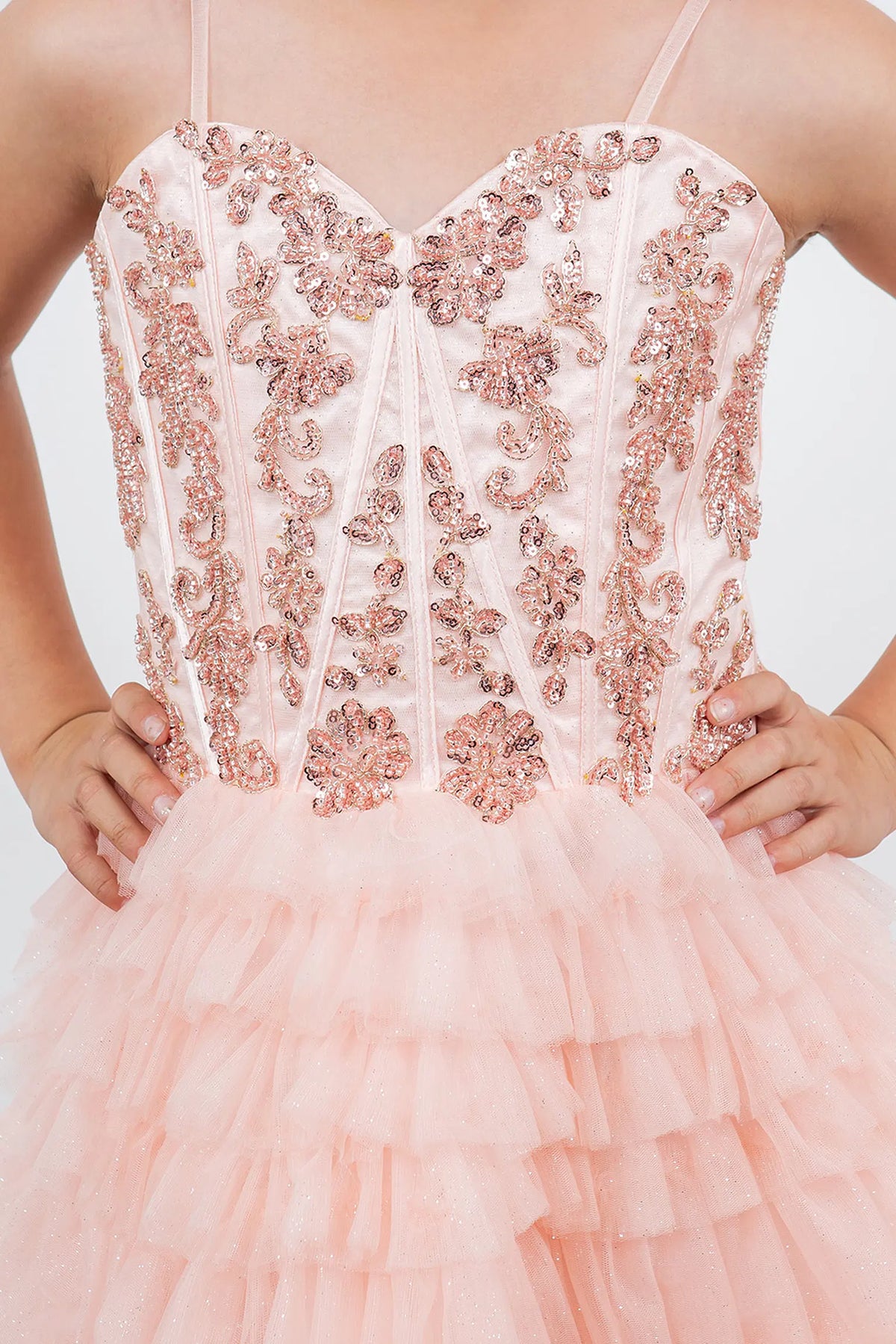 Featuring with tiered tulle ruffles, this Blush kids party dress displays elegant detail.