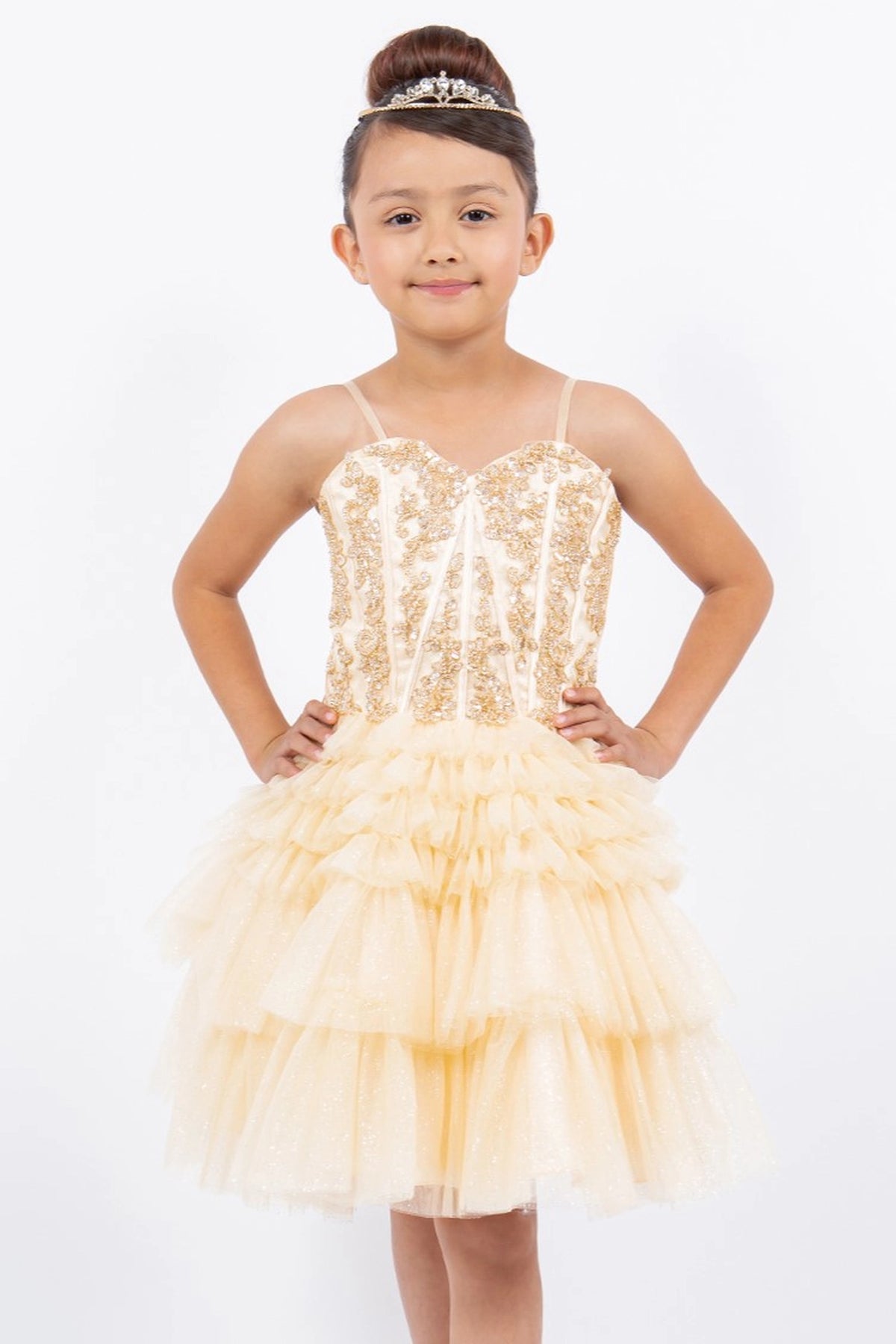 Showcasing with tiered tulle ruffles, this Champagne kids party dress displays elegant detail.