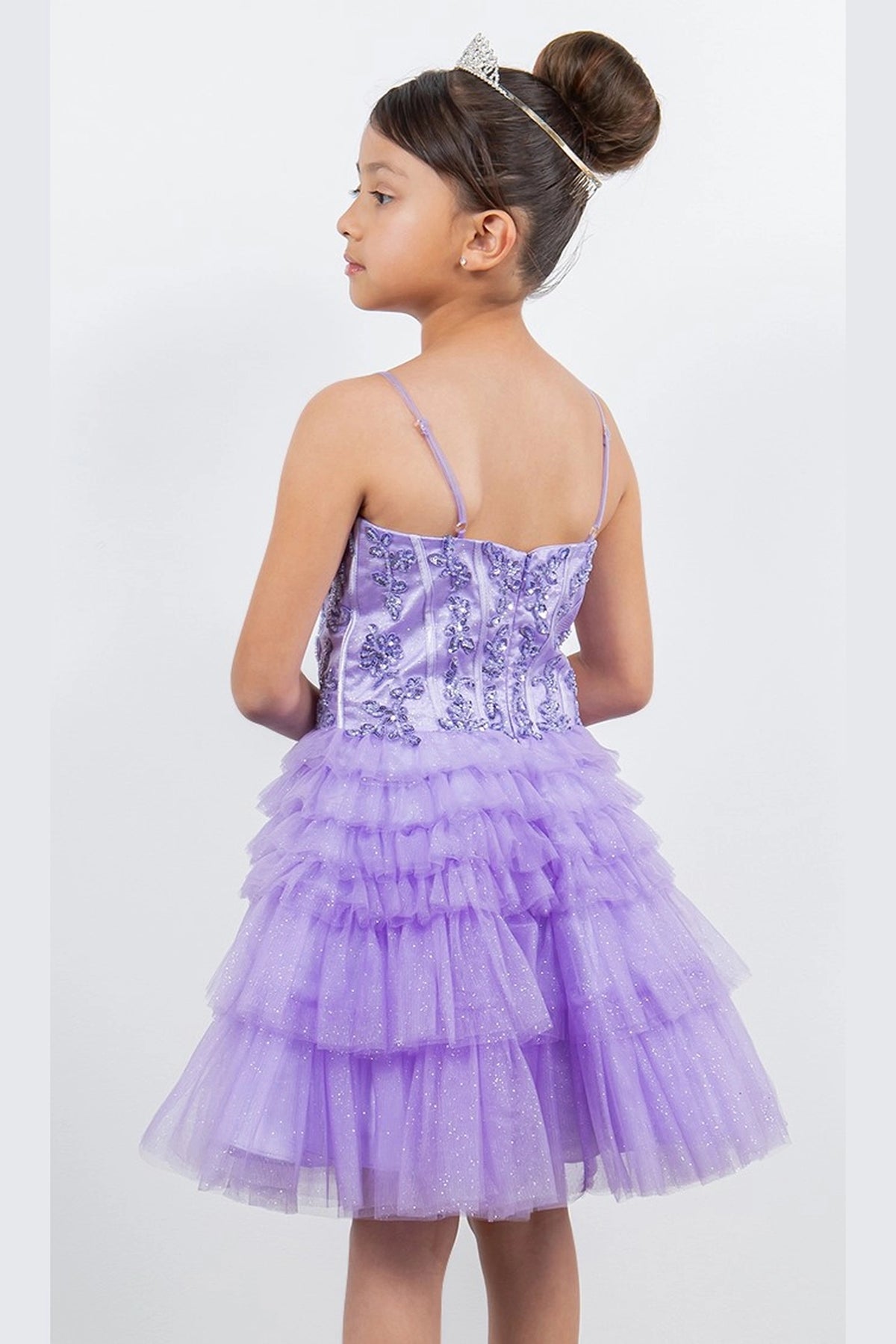 Showcasing with a straight back and tiered ruffles, this Lilac kids party dress displays elegant detail.