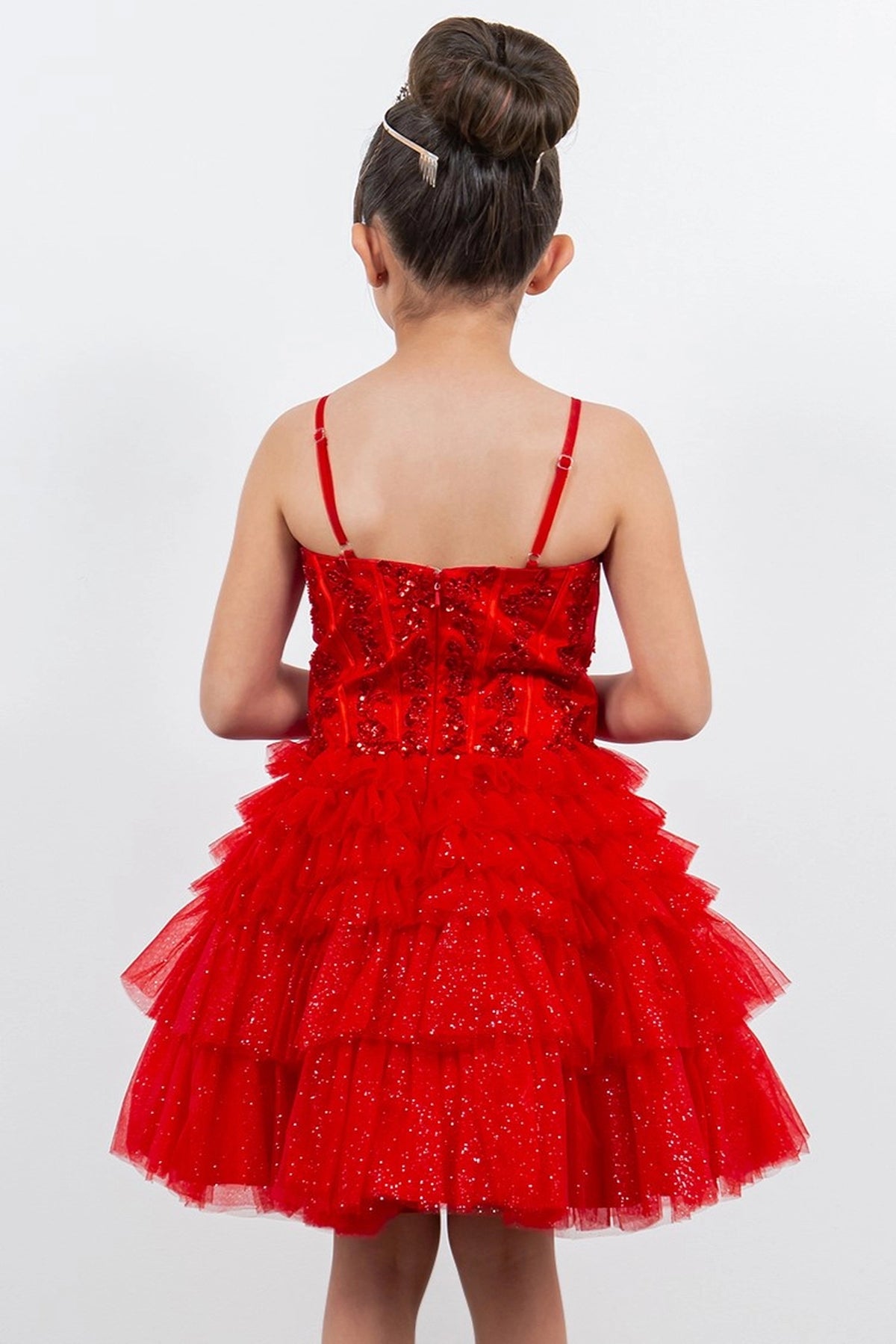 Finished details of a straight back and tiered ruffles distinguish the Red kids party dress.