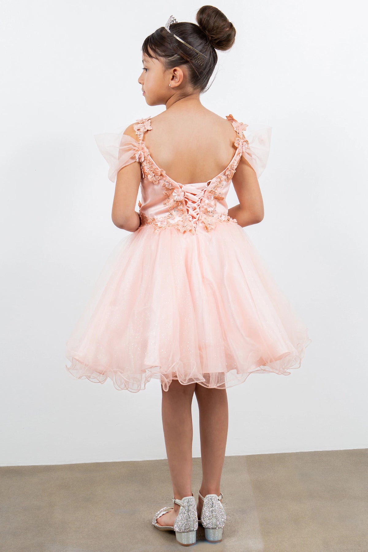 Finished details of floral lace and back lacing distinguish the Blush kids party dress.