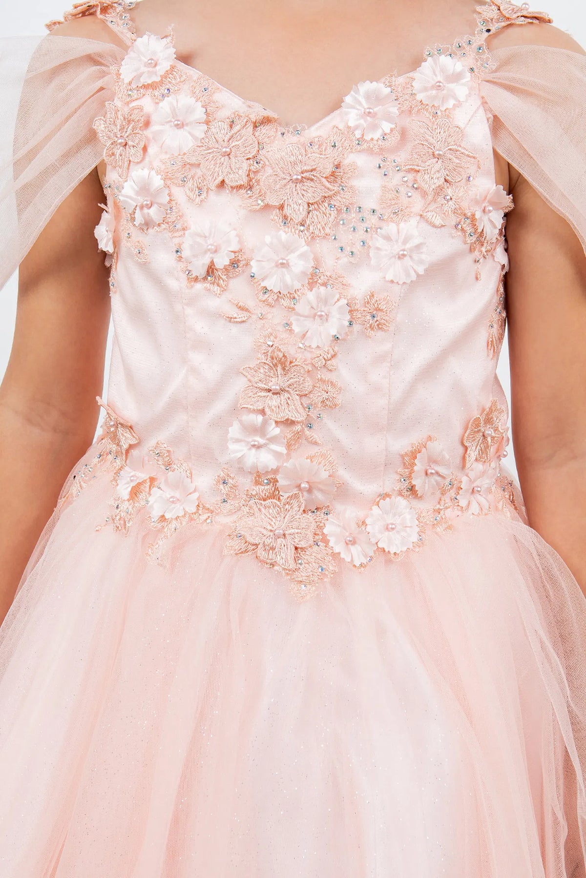 Featuring with dimensional flowers at the shoulders, this Blush kids party dress displays elegant detail.