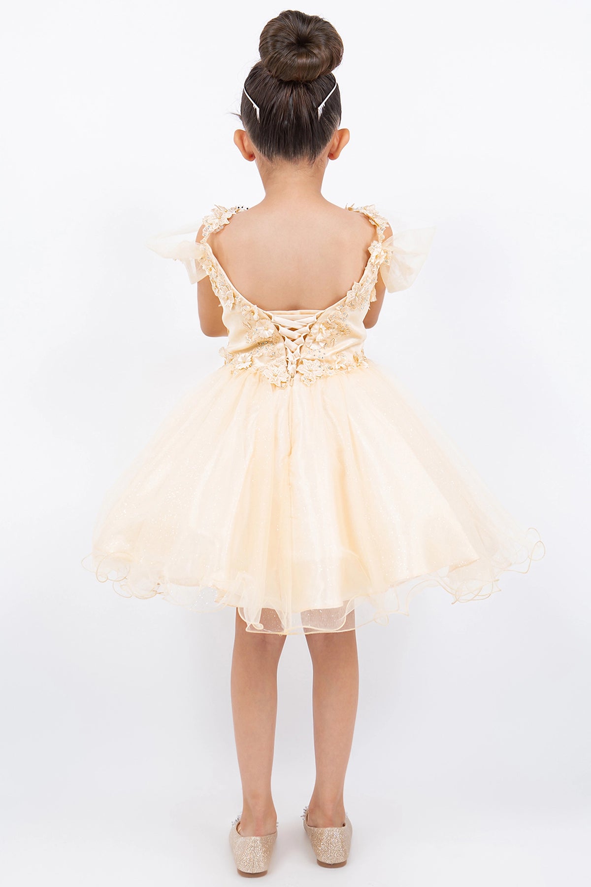 Finished details of floral lace and back lacing distinguish the Champagne kids party dress.