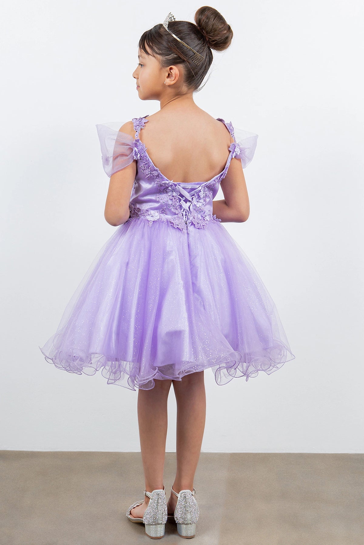 Finished details of floral lace and back lacing distinguish the Lavendar kids party dress.