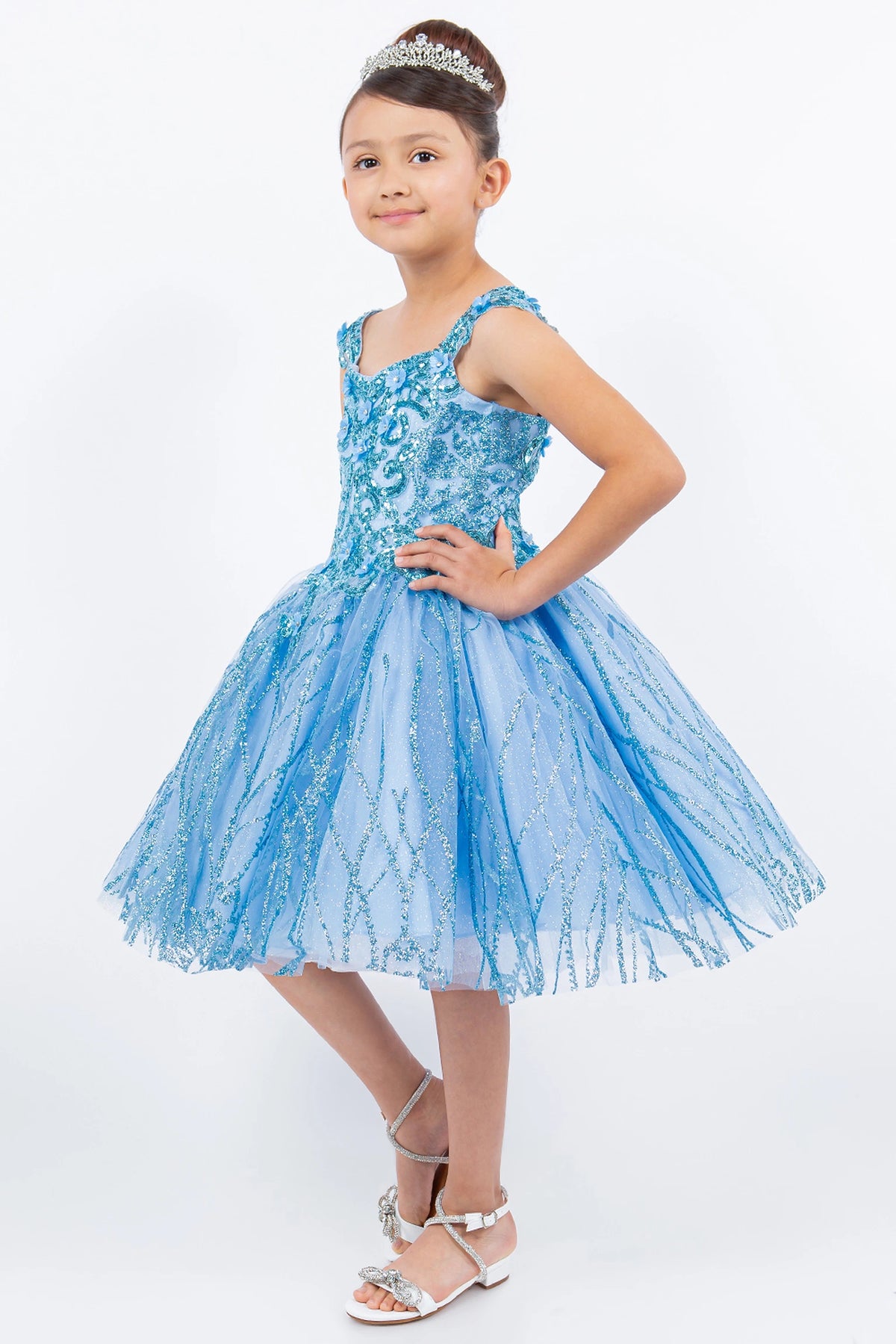Styled with ornate lace across the bodice, this Blue kids party dress displays elegant detail.