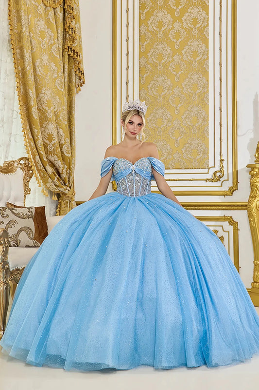 Off-the-shoulder light blue quinceañera ball gown with crystal-embellished corset bodice and full glitter tulle skirt in an elegant gold-accented interior
