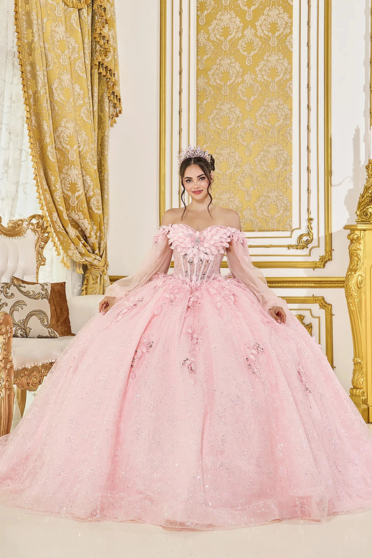 Woman in Blush off-shoulder quinceañera ball gown with 3D floral corset and glitter tulle skirt.