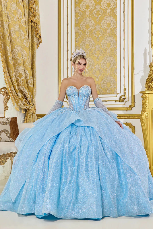 Woman standing front-facing in elegant Bahama blue ball gown with beaded bodice, dramatic layered overskirt, and matching gloves