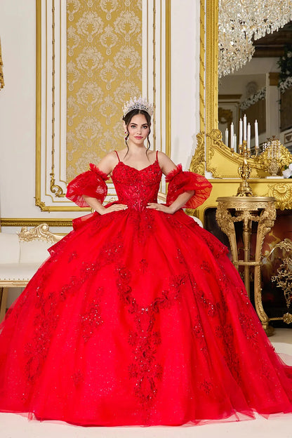 Woman standing front-facing in elegant red ball gown with detachable puff sleeves, beaded bodice, and voluminous layered tulle skirt