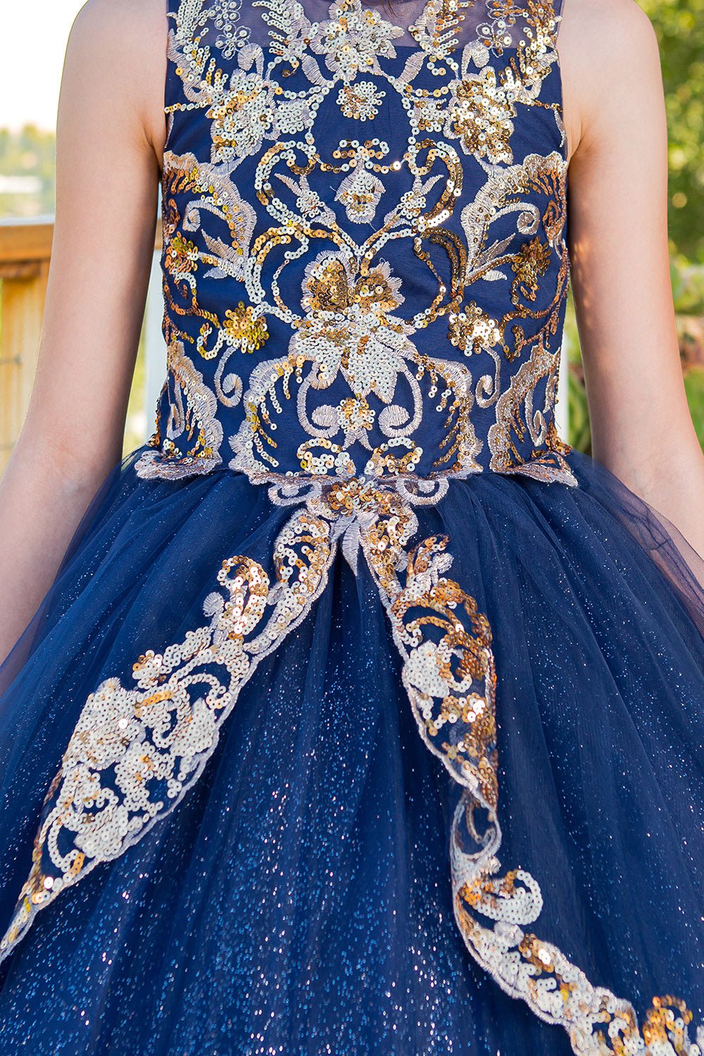 Navy mini quince dress with glittered two-tone lace satin tulle front detail.