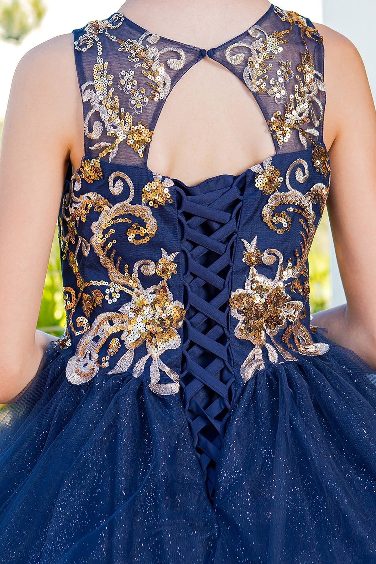 Navy mini quince dress with glittered two-tone lace satin tulle back detail.
