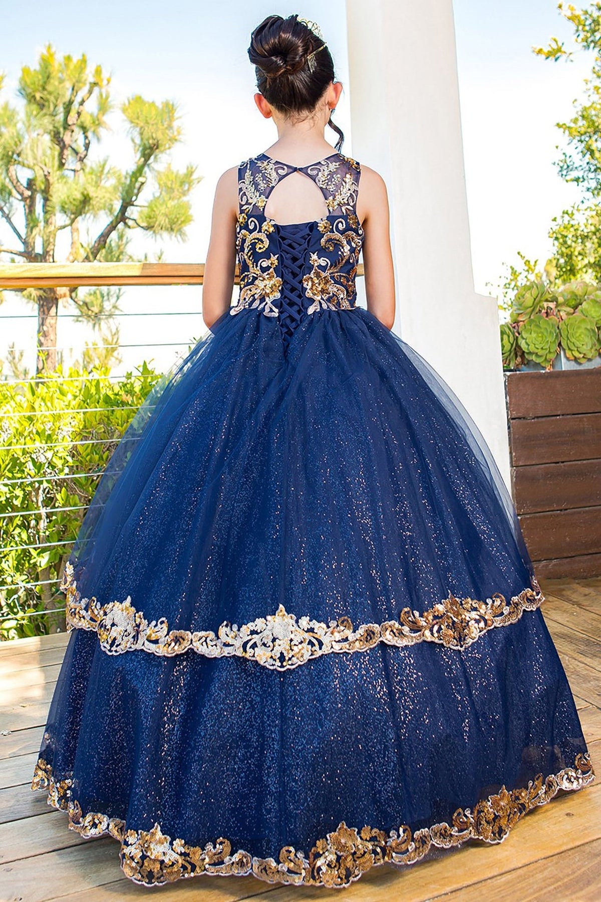 Navy mini quince dress with glittered two-tone lace satin tulle back view.
