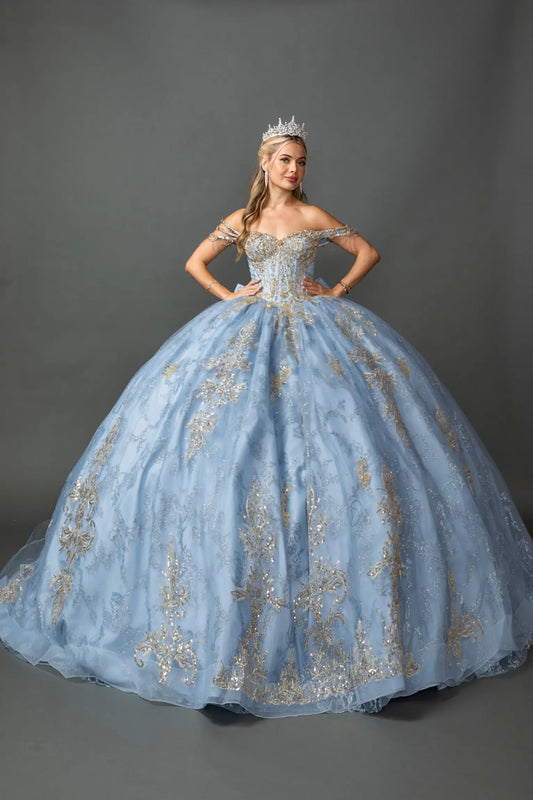 Full front view of a woman wearing a Dusty Blue quinceañera dress with off-shoulder sweetheart neckline, metallic embroidery, beaded corset bodice, and glitter tulle ball gown skirt