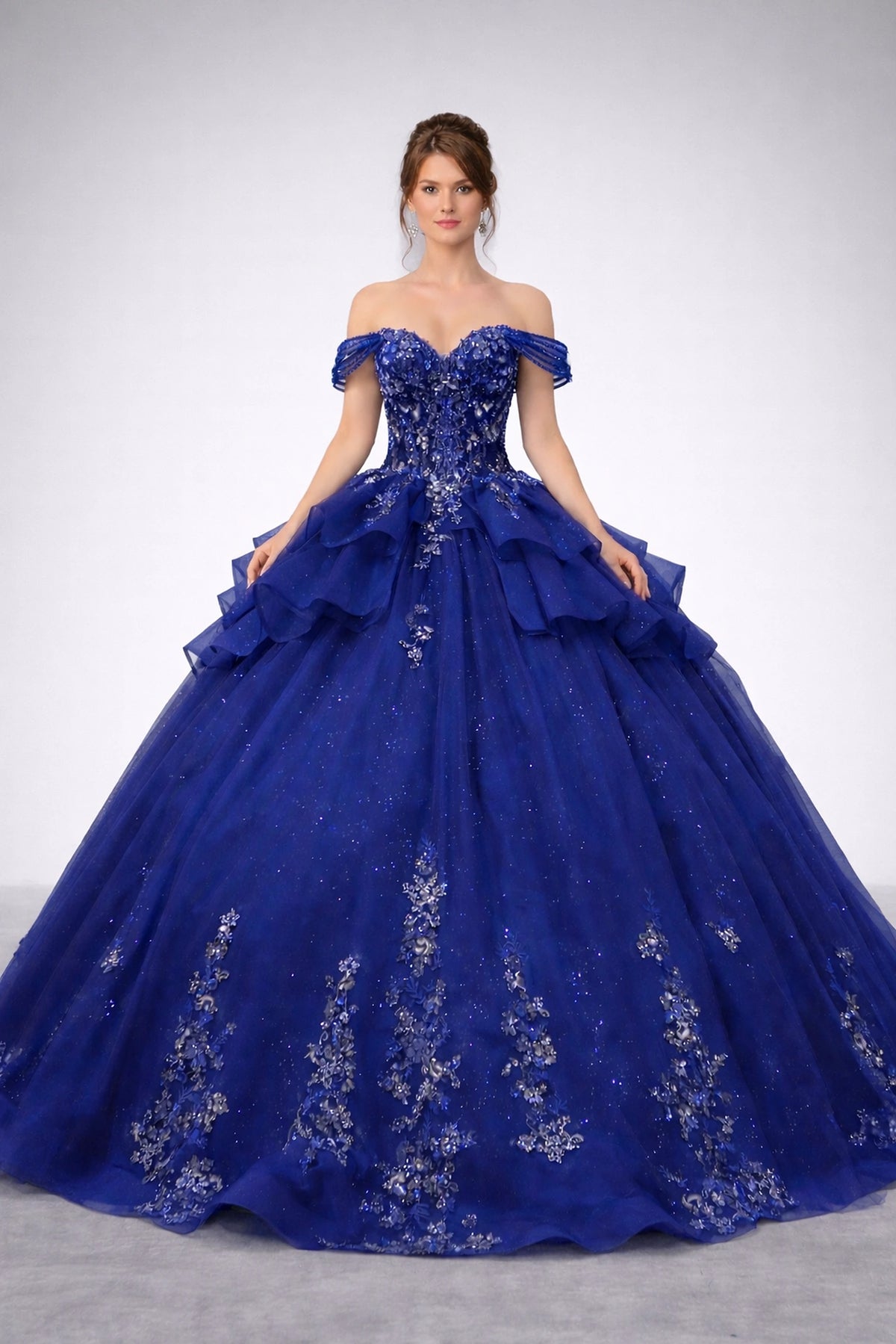 Featuring a floor-length skirt, this Navy quinceañera ball gown is shown in full view.