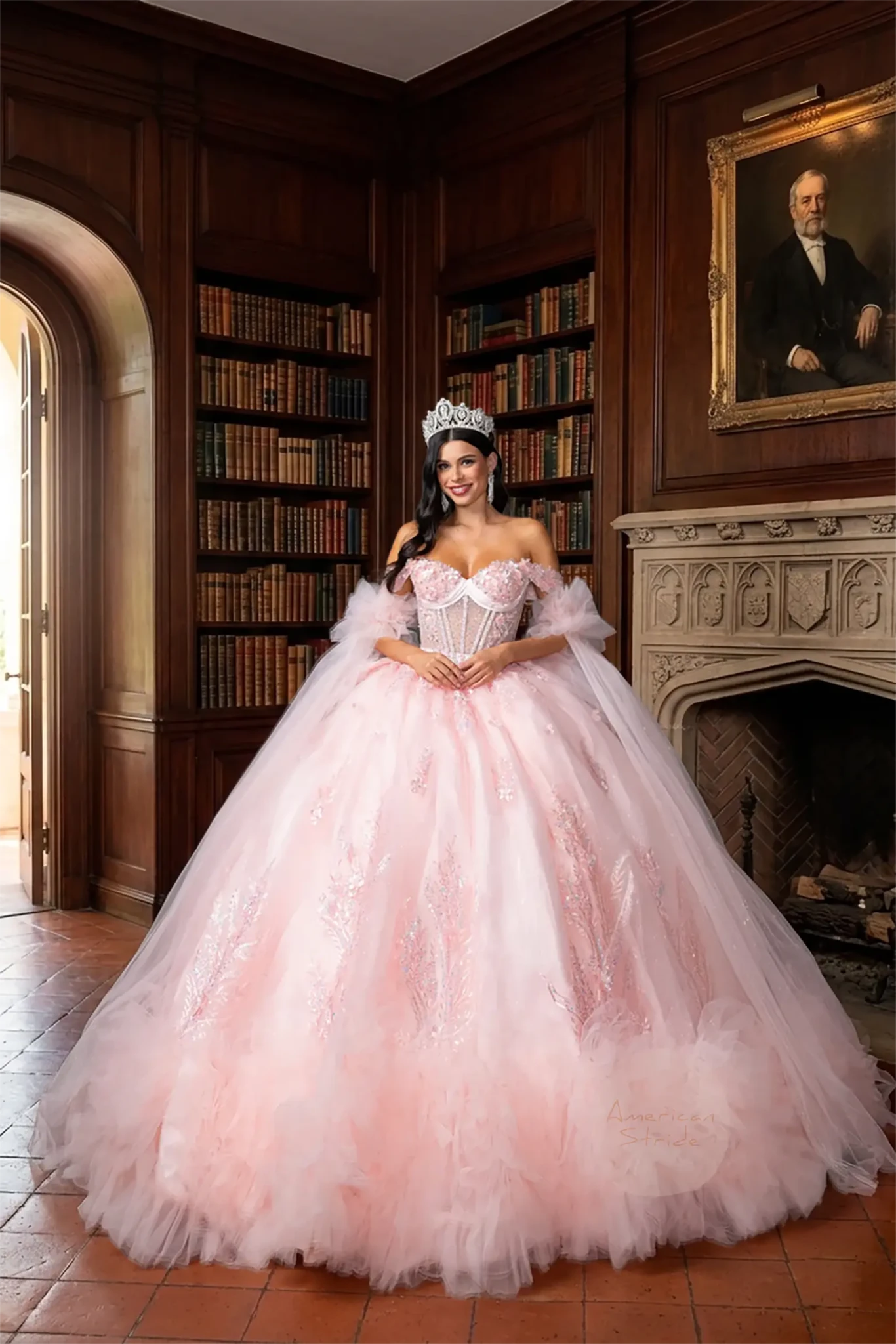Front view of a woman wearing off‑shoulder sweetheart quinceañera ball gown with corset bodice, 3D floral appliqué, layered ruffle tulle skirt, and detachable puff sleeves