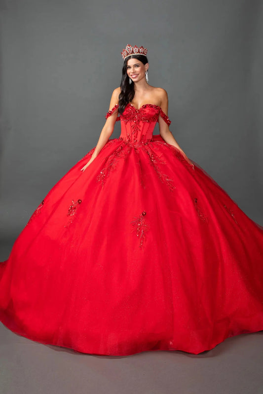 Woman standing front-facing in elegant red ball gown with embellished sweetheart bodice and voluminous embellished tulle skirt

