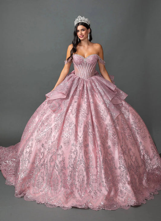 Woman standing front-facing in dusty pink off the shoulder weetheart quinceañera ball gown with beaded corset bodice and glitter embroidered layered skirt