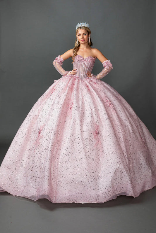 Front view of a woman wearing blush quinceañera, strapless, floral appliques, glitter tulle skirt, detachable gloves