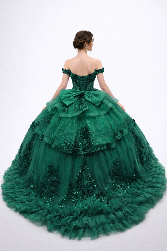 Back view of a woman wearing hunter green quinceañera, lace-up, tiered tulle, floral appliques, off-shoulder sleeves