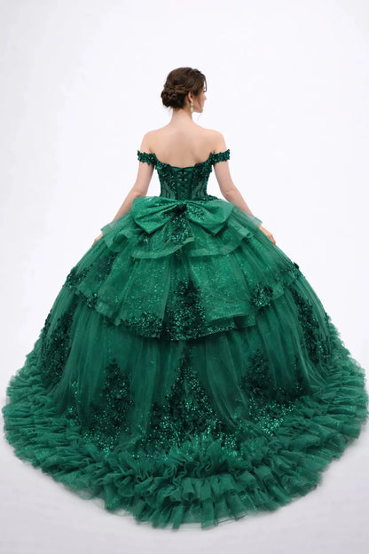 Back view of a woman wearing hunter green quinceañera, lace-up, tiered tulle, floral appliques, off-shoulder sleeves