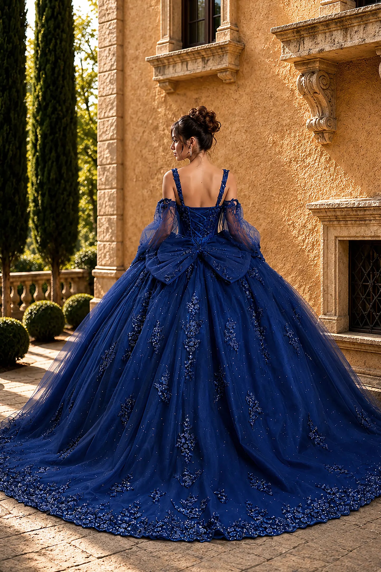 navy quinceanera ball gown with lace-up corset back, detachable puff sleeves, glitter tulle skirt, and back bow