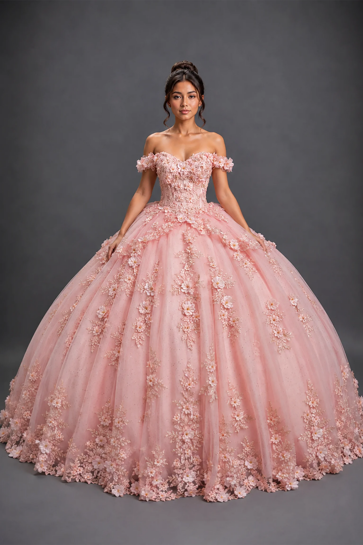 Front view of blush quinceañera dress with 3D floral appliqués and layered tulle ball gown skirt