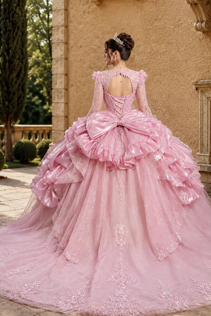 blush quinceanera ball gown with lace-up corset back, tiered overskirt, glitter tulle layers, statement bow and chapel-length train