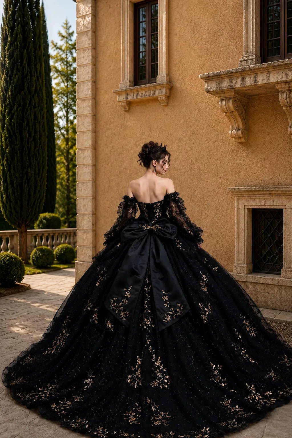 black quinceañera, lace up back design with long train and large back bow