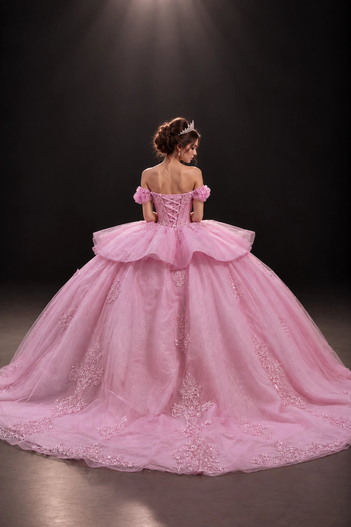 Pink embroidered quinceanera dress with lace-up back and bow, full back view