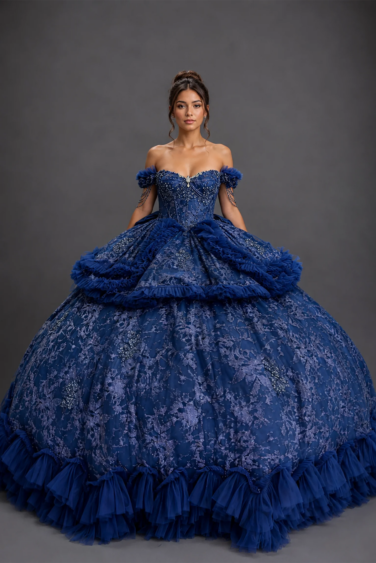 Front view of navy quinceañera dress with glitter lace, beaded bodice and tiered ruffle skirt