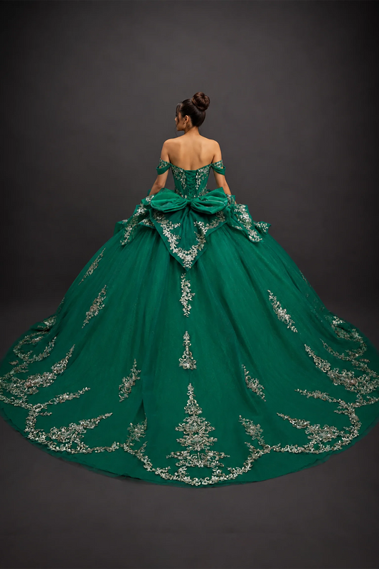 Back view of hunter green quinceañera dress with lace-up corset and ornate appliqué train