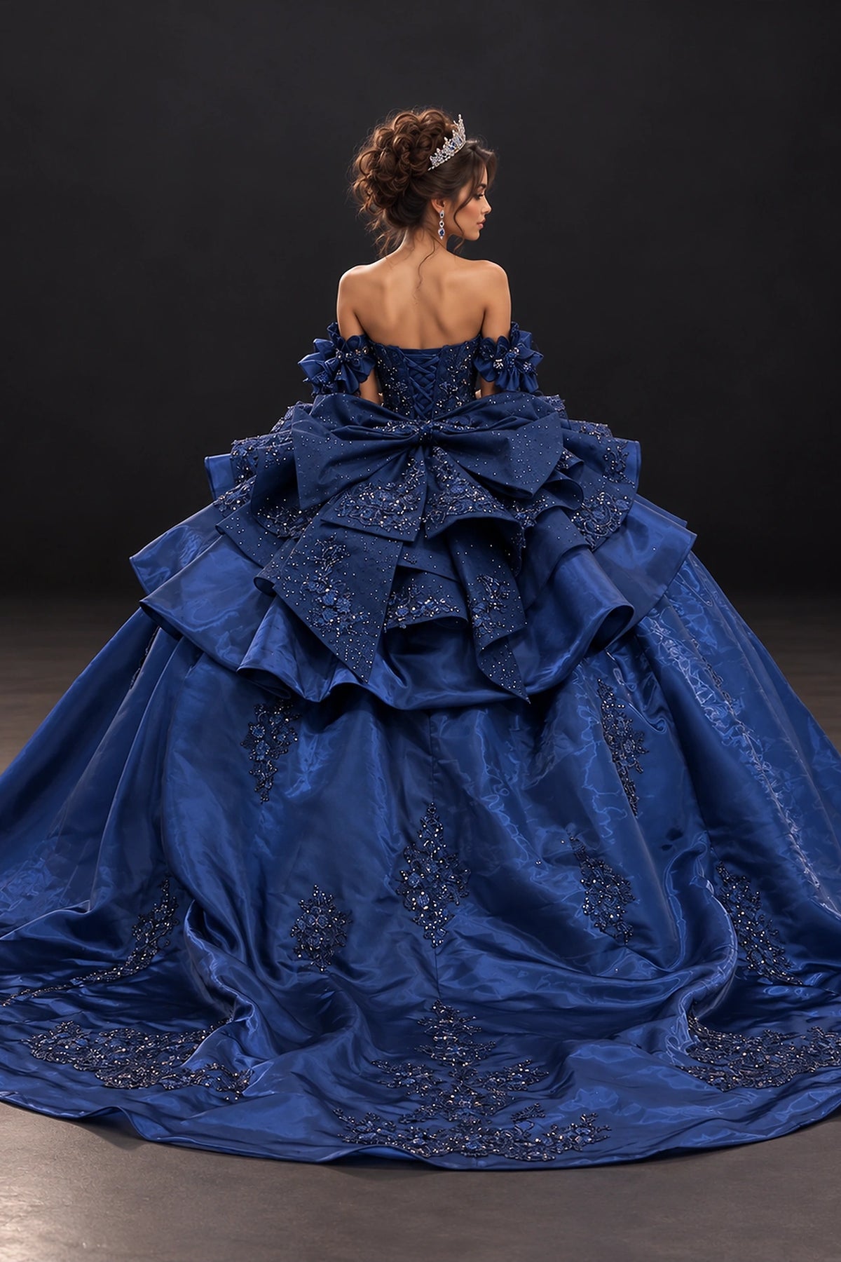 From the back, the Navy quinceañera ball gown reveals its floor-length skirt.