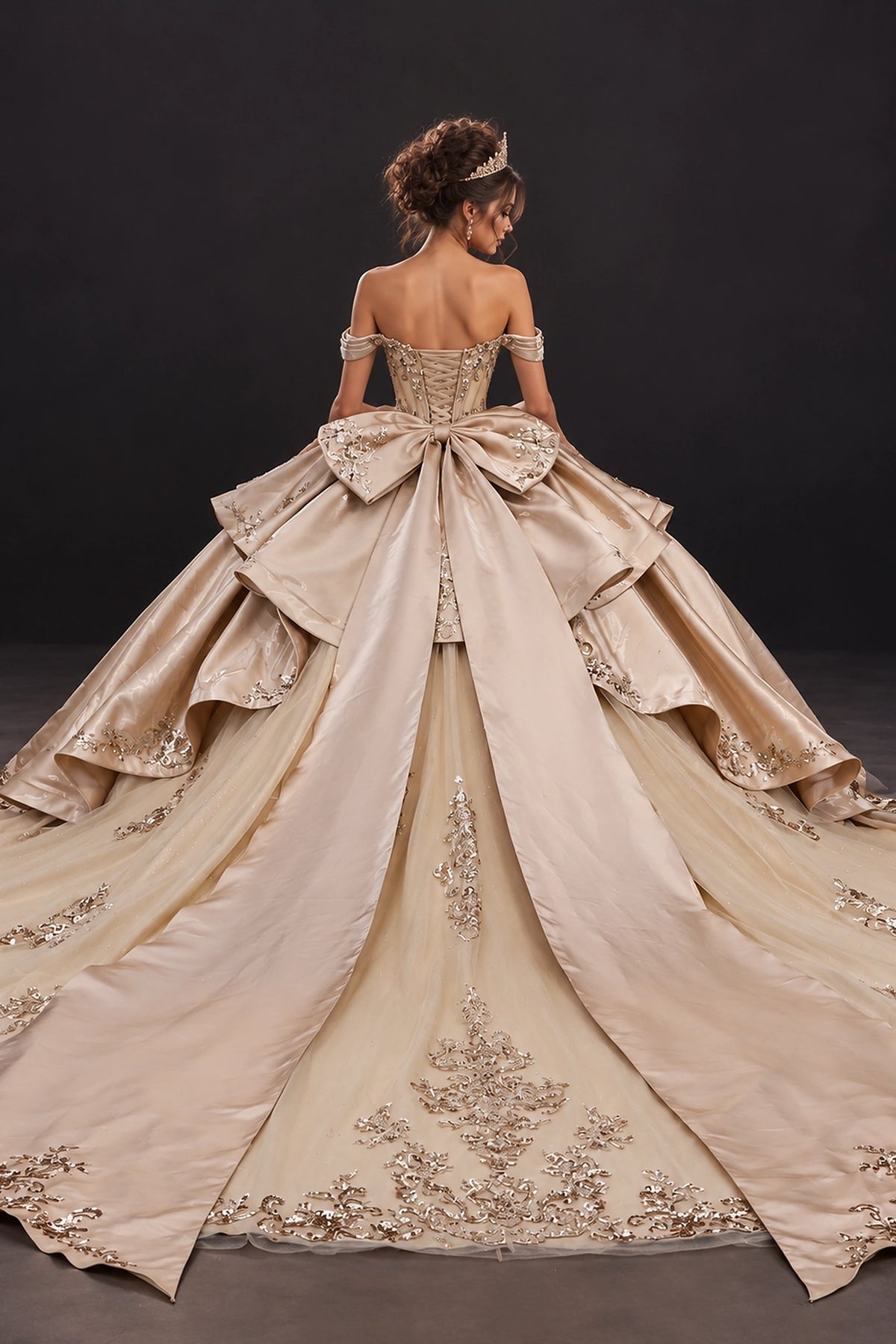 From the back, the Gold quinceañera ball gown reveals its floor-length skirt.