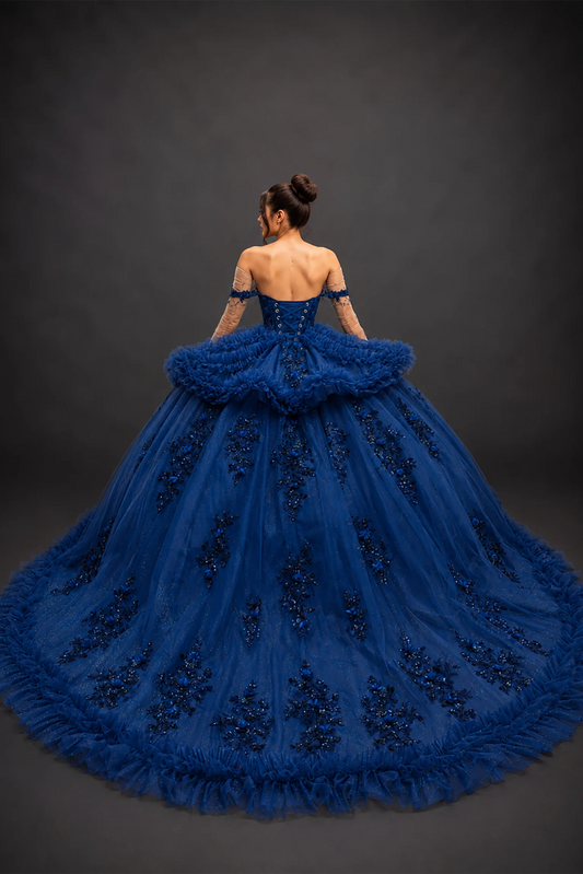 Back view of navy quinceañera dress with lace-up corset and tiered ruffle train
