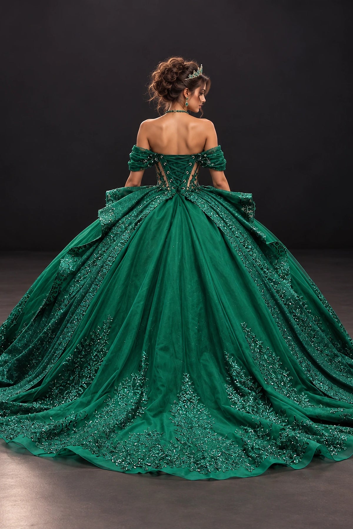 From the back, the Hunter Green quinceañera ball gown reveals its floor-length skirt.