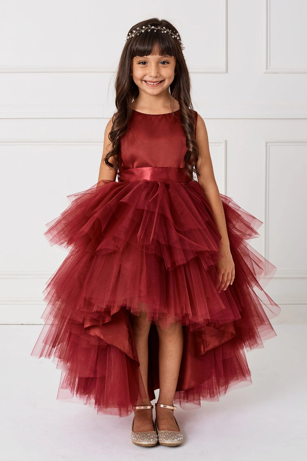 Burgundy kids pageant dress featuring a satin bodice and layered high-low tulle.