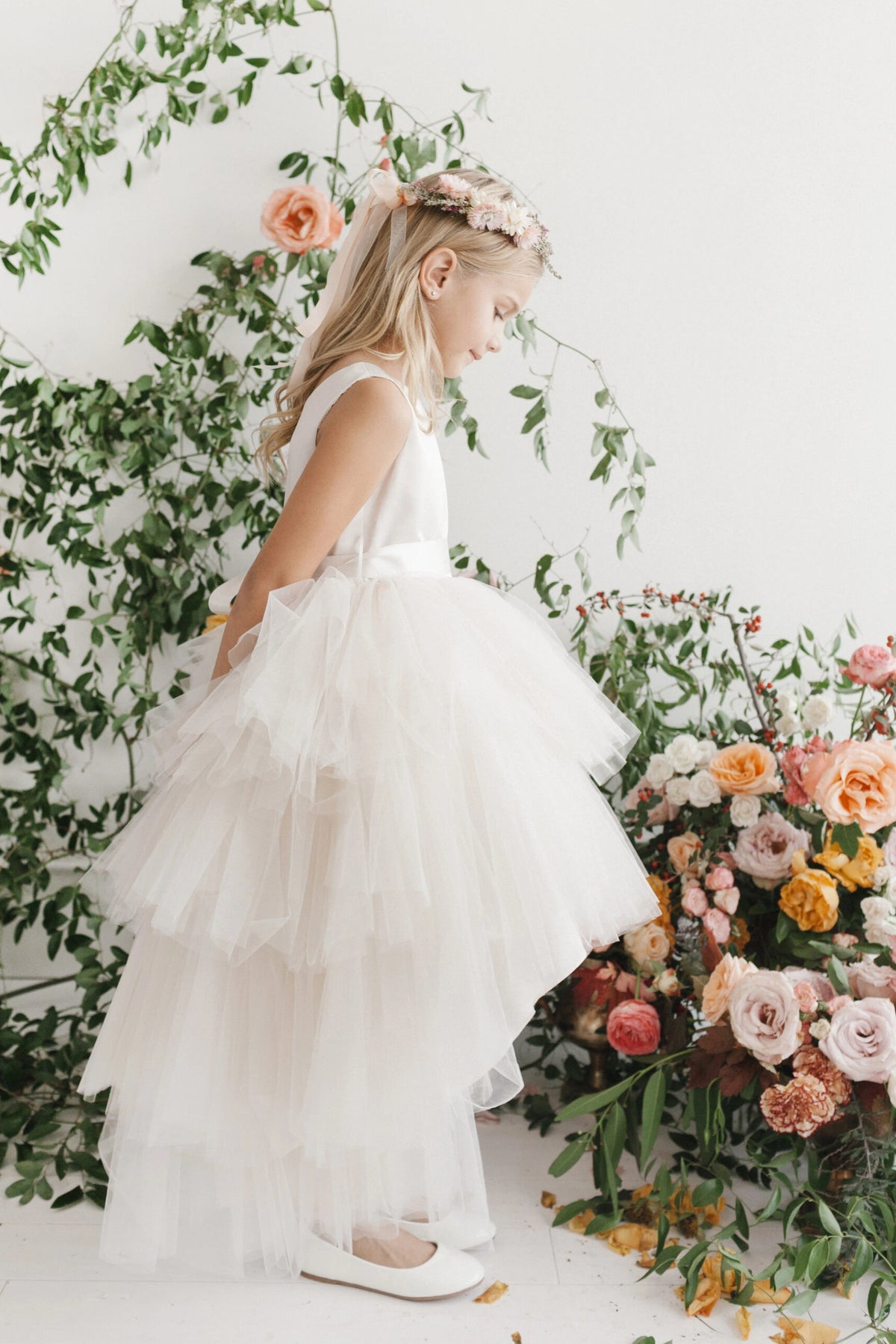 The Ivory kids pageant dress has a tied sash across the back waist.